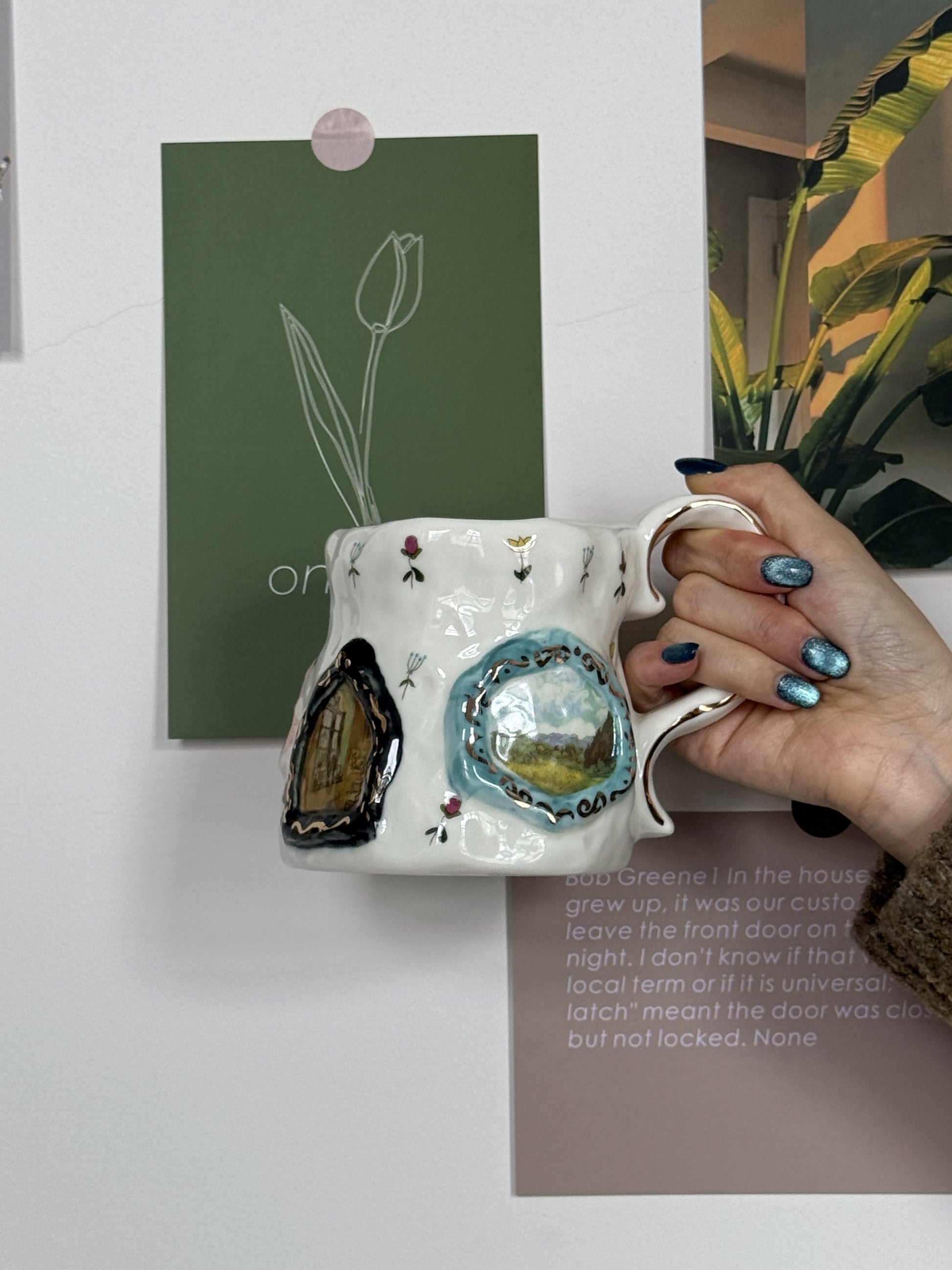 Handmade ceramic mug with floral designs