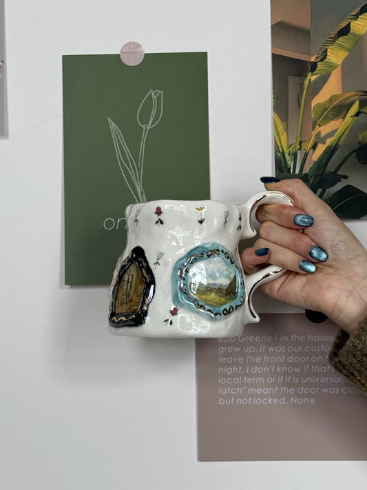 Handmade ceramic mug with floral designs