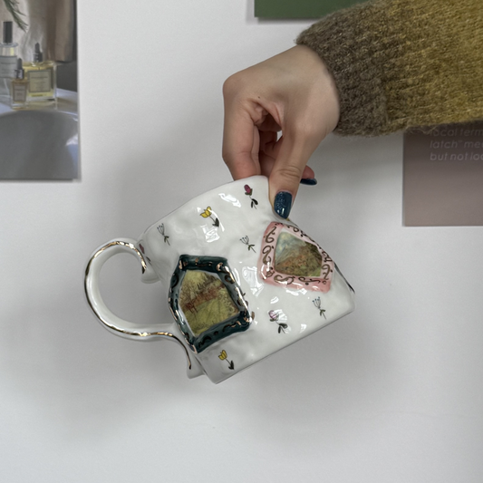 Handmade ceramic mug with floral designs